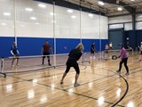 People playing pickleball in Homecourt