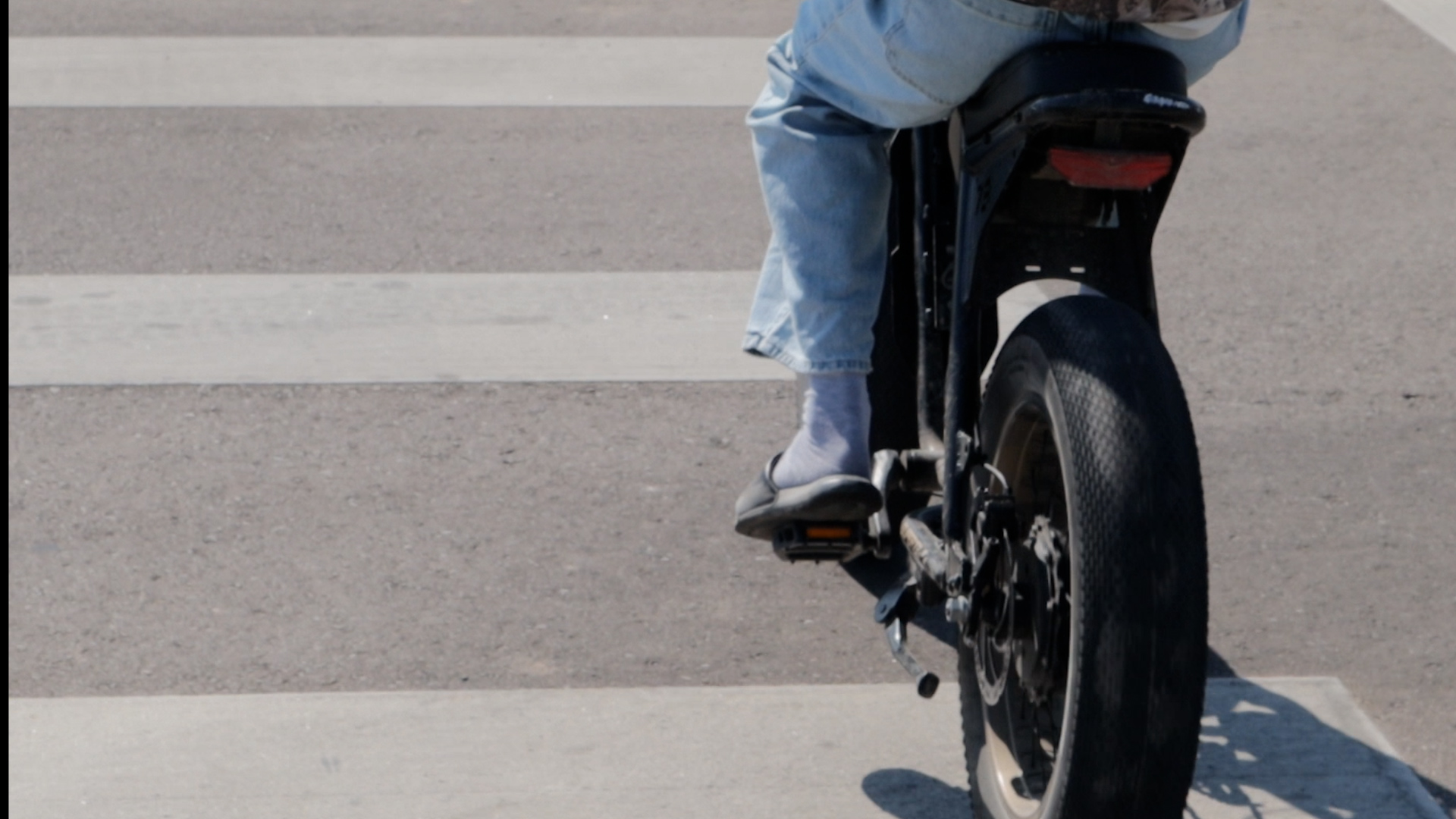 E-bike with pedals in the crosswalk
